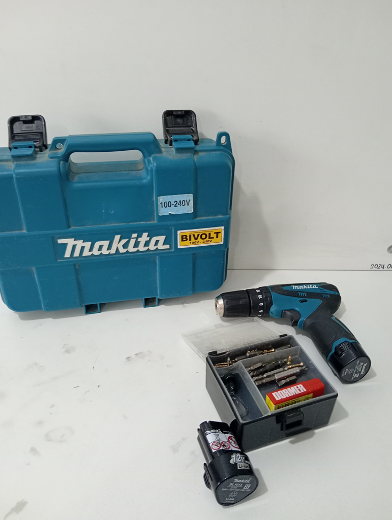 Foto 2 de Taladro Marca Makita A Bateria Modelo Hp330d Acc Dos BateriasCargadorCaja Con MechasBandolera